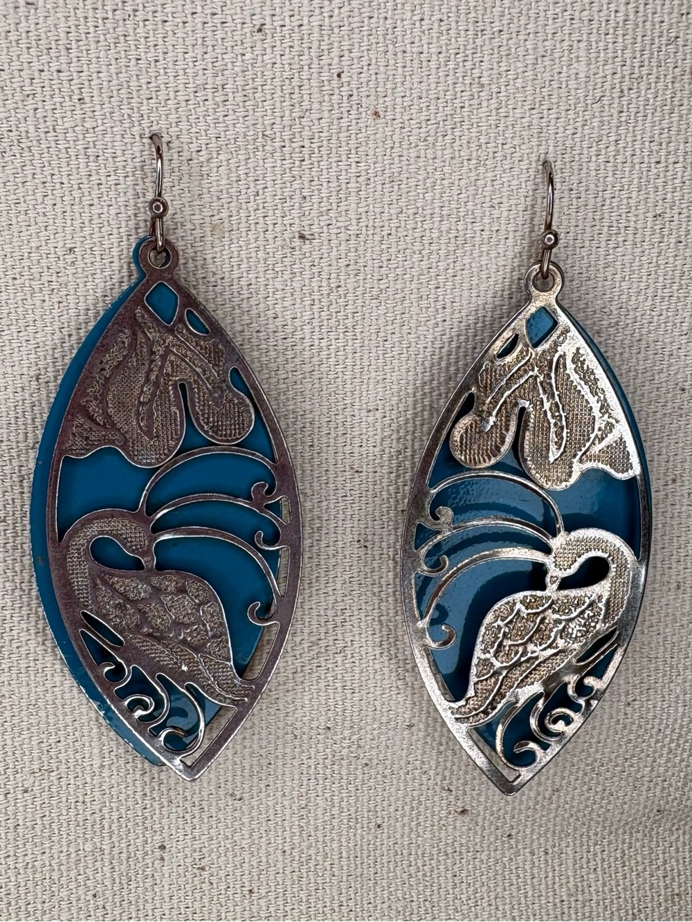 Silver Tone Cutout Peacock over Pinched Oval Teal Earrings